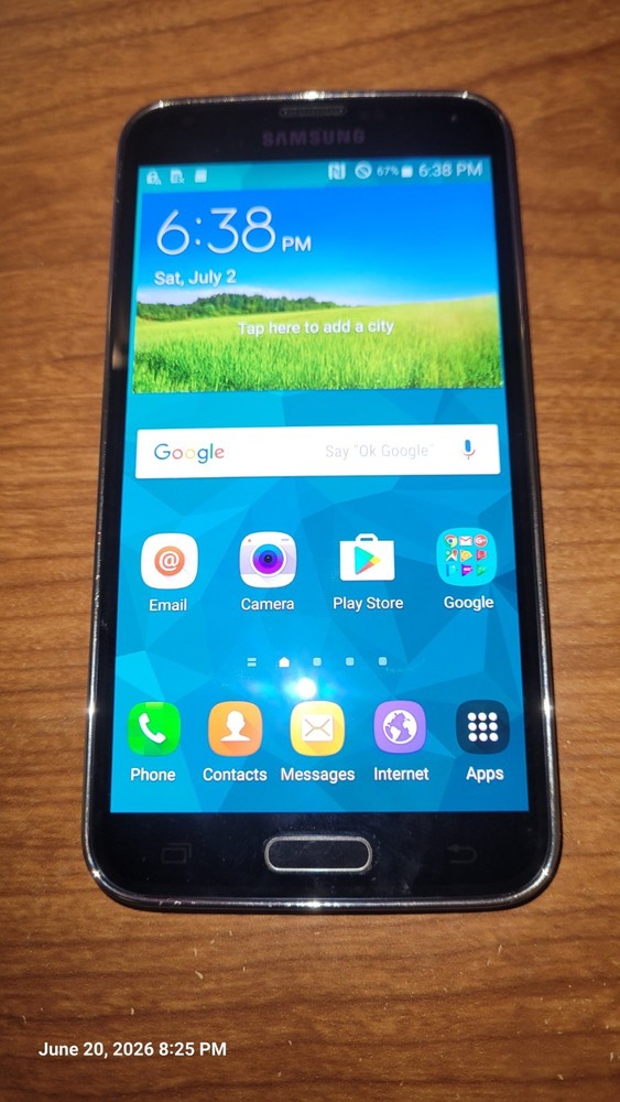 Samsung Galaxy S5 (SM-G900A) Black + 32GB SD Card + Otter Box + 2 Belt Clips