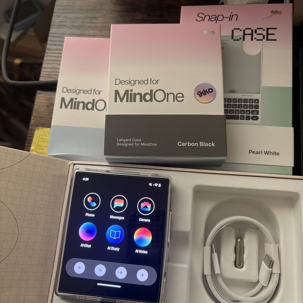 iKKO MindOne Pro with boxes, cases, and screen protectors.