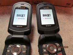 (2) Kyocera E4277 DuraXT Sprint Cell Phones for parts Unknown condition see pics