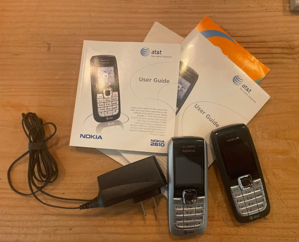 TWO working Nokia 2610 cell phone, power cord, and manual